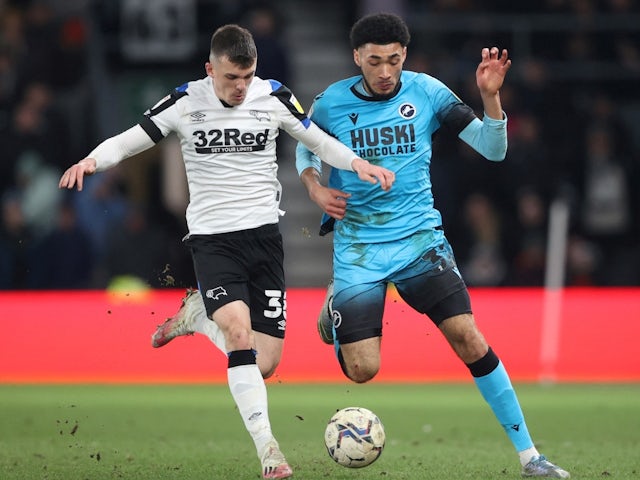 Derby County's Jason Knight in action with Millwall's Tyler Burey, on February 23, 2022