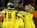 Borussia Dortmund's Thorgan Hazard celebrates scoring their first goal with teammates on February 27, 2022