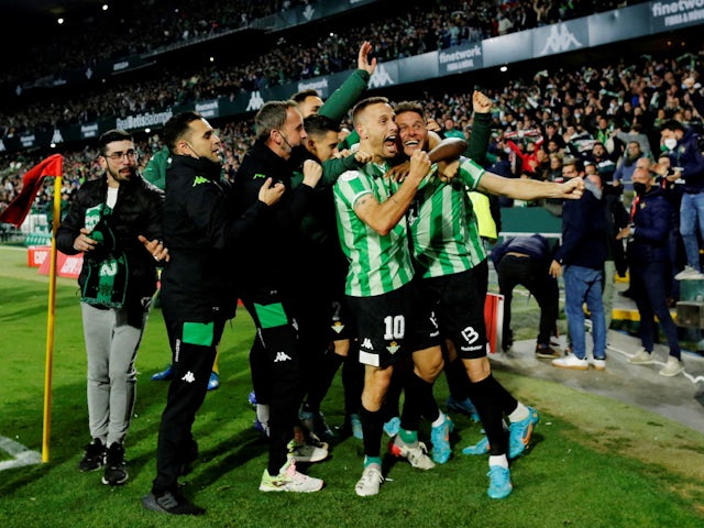 Real Betis' Borja Iglesias celebrates scoring their first goal with teammates on March 3, 2022