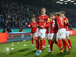 Freiburg's Roland Sallai celebrates scoring their second goal with teammates on March 2, 2022