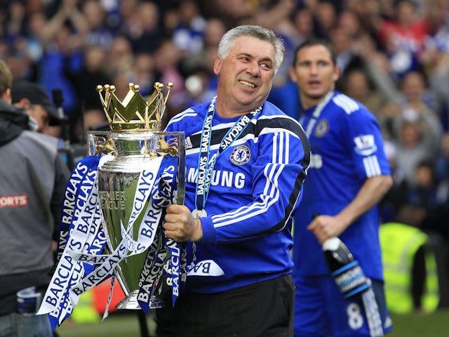 Carlo Ancelotti celebrates with the Premier League trophy as Chelsea boss in 2010