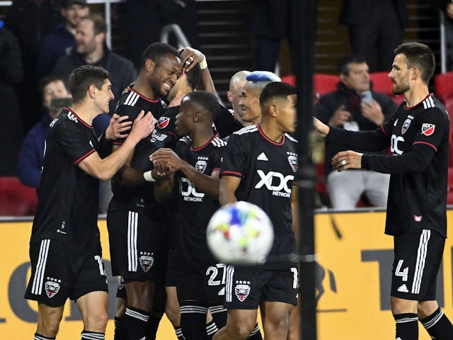DC United forward Michael Estrada (7) celebrates with teammates after scoring a goal against the Charlotte FC in the first half at Audi Field on February 26, 2022