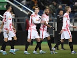 RB Leipzig's Christopher Nkunku celebrates scoring their first goal with teammates on March 2, 2022