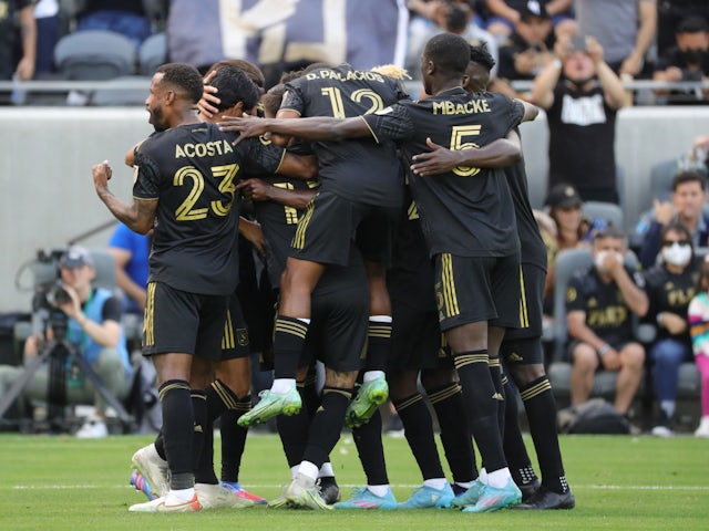 Los Angeles FC forward Carlos Vela (10) celebrates with his teammates after he scores a penalty kick in the first half against the Colorado Rapids at Banc of California Stadium on February 26, 2022