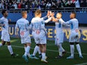 Marseille's Dimitri Payet celebrates scoring their first goal with teammates on February 27, 2022