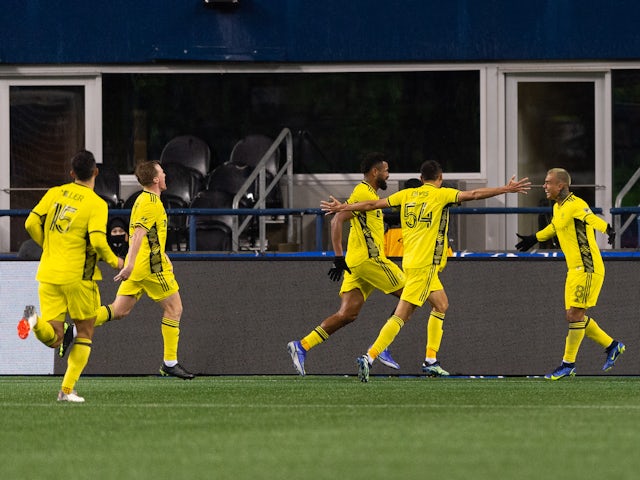 The Nashville SC celebrate after scoring a goal against the Seattle Sounders during the second half at Lumen Field on February 27, 2022.