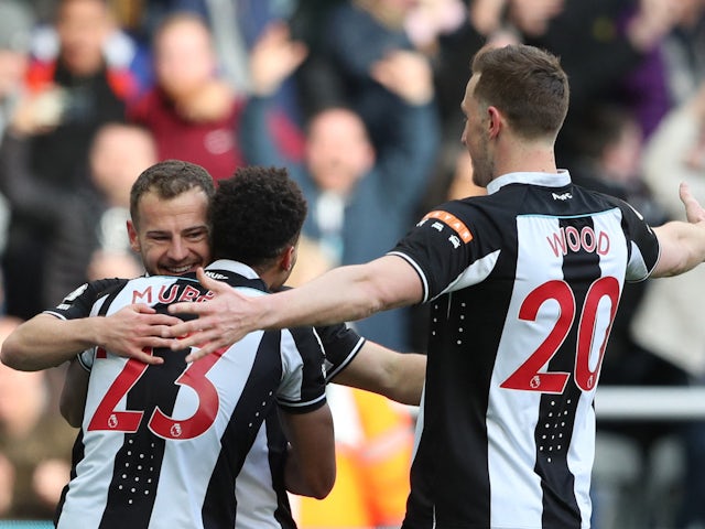 Newcastle United's Ryan Fraser celebrates scoring their first goal with Jacob Murphy and Chris Wood on March 5, 2022