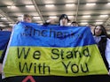Manchester City fans display a Ukraine flag referencing Oleksandr Zinchenko inside the stadium before the match on March 1, 2022