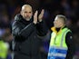 Manchester City manager Pep Guardiola applauds fans after the match on March 1, 2022