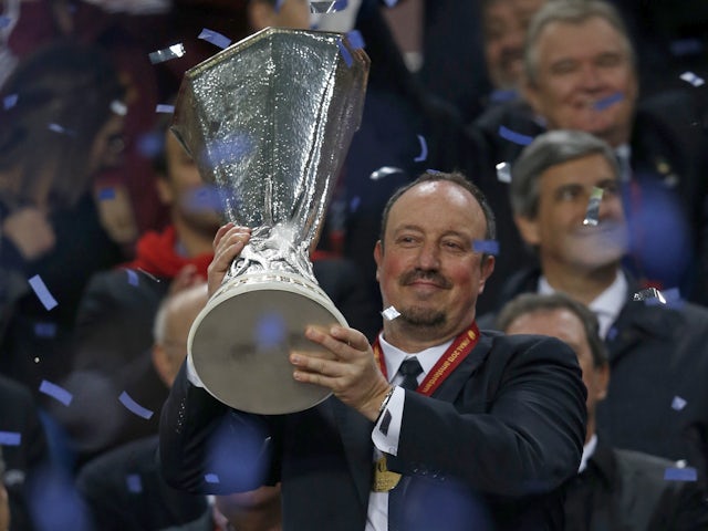 Rafael Benitez celebrates with the Europa League trophy in 2013