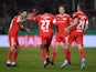 Union Berlin's Sheraldo Becker celebrates scoring their first goal with teammates on March 1, 2022
