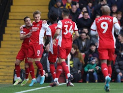 Arsenal's Martin Odegaard celebrates scoring their first goal with Cedric Soares and Bukayo Saka on March 6, 2022