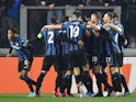 Atalanta's Luis Muriel celebrates scoring their third goal with Rafael Toloi, Berat Djimsiti, Merih Demiral, Teun Koopmeiners and teammates on March 10, 2022