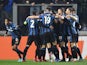 Atalanta's Luis Muriel celebrates scoring their third goal with Rafael Toloi, Berat Djimsiti, Merih Demiral, Teun Koopmeiners and teammates on March 10, 2022