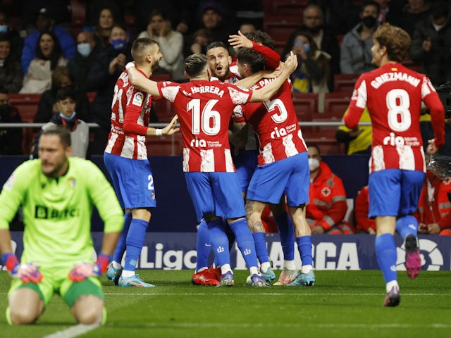 Atletico Madrid's Joao Felix celebrates scoring their first goal with teammates on March 10, 2022