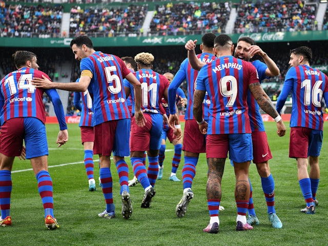 Barcelona's Memphis Depay celebrates scoring their second goal with teammates on March 6, 2022
