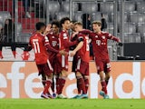 Bayern Munich's Robert Lewandowski celebrates scoring their first goal with teammates on March 7, 2022