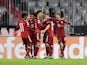 Bayern Munich's Robert Lewandowski celebrates scoring their first goal with teammates on March 7, 2022