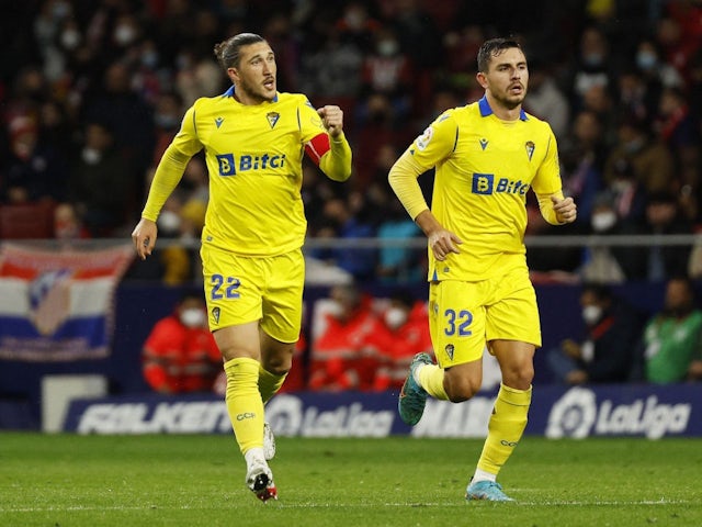Cadiz's Luis Alfonso Espino and Victor Chust celebrate their first goal scored by Alvaro Negredo on March 10, 2022