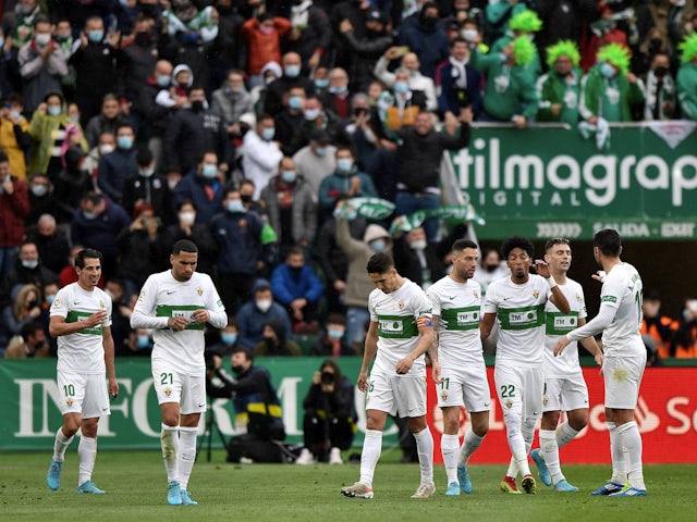 Elche's Fidel celebrates scoring their first goal with teammates on March 6, 2022