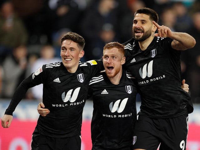Fulham's Aleksandar Mitrovic celebrates scoring their first goal with teammates on March 8, 2022