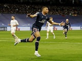 Paris Saint-Germain's Kylian Mbappe celebrates scoring against Real Madrid on March 9, 2022