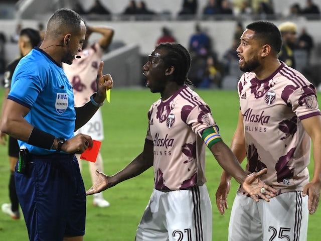 Portland Timbers midfielder Diego Chara (21) and defender Bill Tuiloma (25) plead their case to referee Ismail Elfath after a red card was issued in the second half against the Los Angeles FC at Banc of California Stadium on March 6, 2022