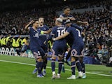 Paris Saint-Germain's (PSG) Kylian Mbappe celebrates scoring their first goal with teammates on March 9, 2022