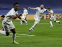 Real Madrid's Vinicius Junior and Karim Benzema celebrate a goal against Paris Saint-Germain on March 9, 2022