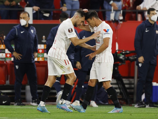 Sevilla's Munir celebrates scoring their first goal with Oliver Torres on March 10, 2022
