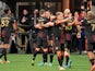 Atlanta United celebrate after midfielder Jake Mulraney (23) scored a goal against Charlotte FC during the second half at Mercedes-Benz Stadium. on March 13, 2022