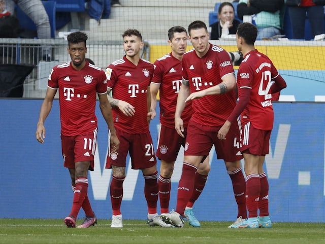 Bayern Munich's Robert Lewandowski celebrates scoring their first goal with teammates on March 12, 2022