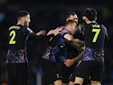 Tottenham Hotspur's Cristian Romero celebrates scoring their first goal with Son Heung-min, Matt Doherty and teammates on March 16, 2022