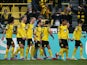 Borussia Dortmund's Marius Wolf celebrates scoring their first goal with teammates on March 13, 2022
