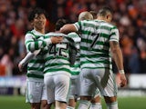 Celtic's Callum McGregor celebrates scoring their first goal with Reo Hatate and Georgios Giakoumakis on March 14, 2022