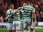 Celtic's Callum McGregor celebrates scoring their first goal with Reo Hatate and Georgios Giakoumakis on March 14, 2022