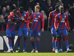 Crystal Palace's Marc Guehi celebrates scoring their first goal with Cheikhou Kouyate and Joachim Andersen on March 20, 2022