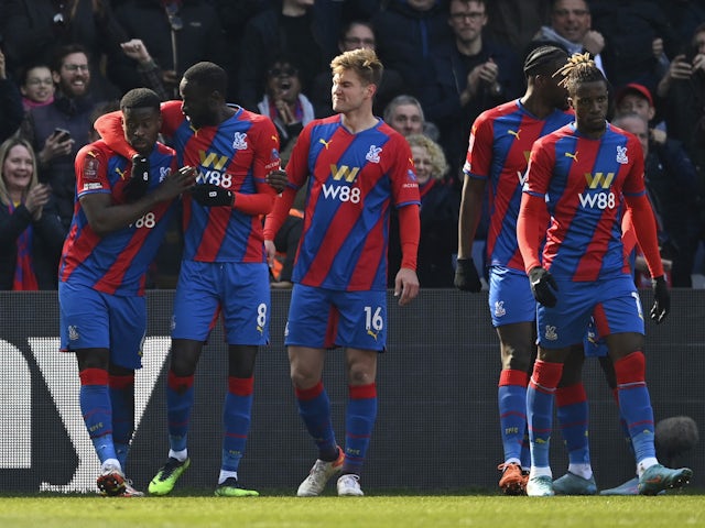 Crystal Palace's Marc Guehi celebrates his first goal with Cheikhou Kouyate and Joachim Andersen on March 20, 2022