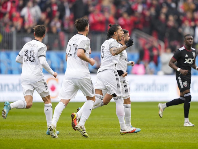 Toronto FC defender Carlos Salcedo (3) and Toronto FC midfielder Alejandro Pozuelo (10) celebrate a goal against the D.C. United at BMO Field on March 19, 2022