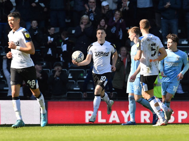 Derby County's Tom Lawrence celebrates scoring their first goal on March 19, 2022