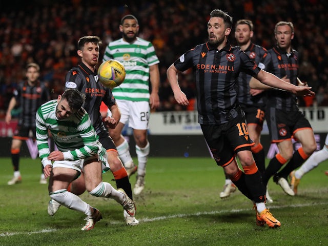 Celtic's Greg Taylor in action with Dundee United's Nicholas Clark on March 14, 2022