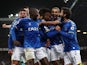 Everton's Alex Iwobi celebrates scoring their first goal with teammates on March 17, 2022