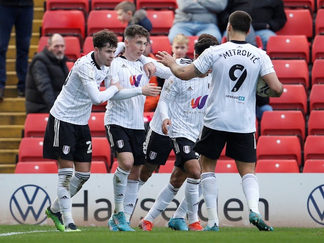 Fulham's Harry Wilson celebrates scoring their first goal with teammates on March 12, 2022