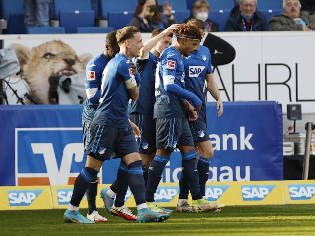Hoffenheim's Christoph Baumgartner celebrates with his teammates after scoring his first goal on 12 March 2022