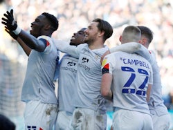 Luton Town's Harry Cornick celebrates with teammates after he scores their second goal on March 19, 2022
