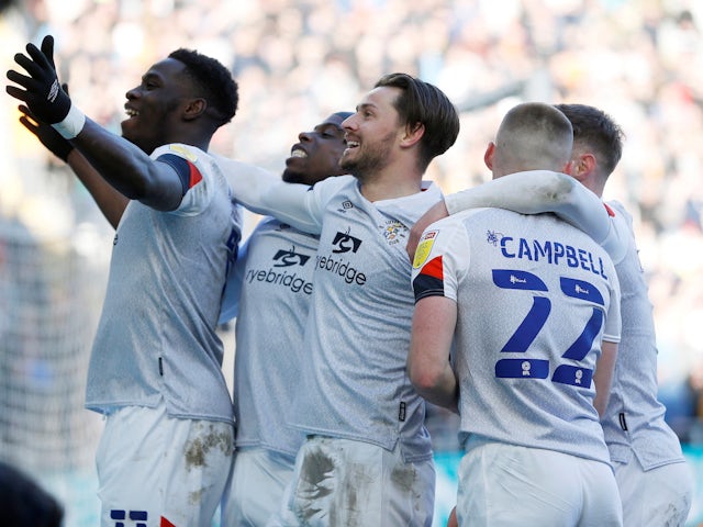 Luton Town's Harry Cornick celebrates with his teammates after scoring his second goal on 19 March 2022