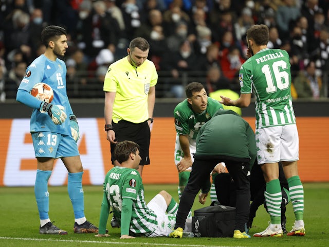 Real Betis' Juan Miranda receives medical assistance after sustaining an injury on March 17, 2022