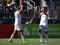 Los Angeles Galaxy forward Javier Hernandez (14) celebrates with midfielder Efrain Alvarez (26) after scoring a goal against the Seattle Sounders FC during the first half at Lumen Field on March 12, 2022