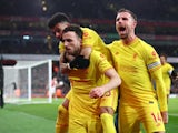 Liverpool's Diogo Jota celebrates scoring their first goal with Luis Diaz and Jordan Henderson on March 16, 2022