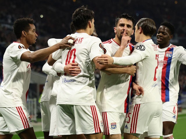 Lyon's Moussa Dembele celebrates scoring their first goal with teammates on March 17, 2022